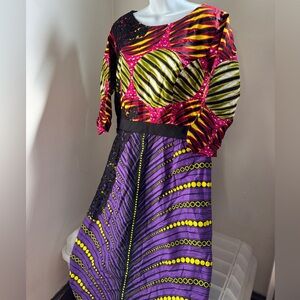 African print maxi dress Ankara fabric vibrant pattern black lace detailing.